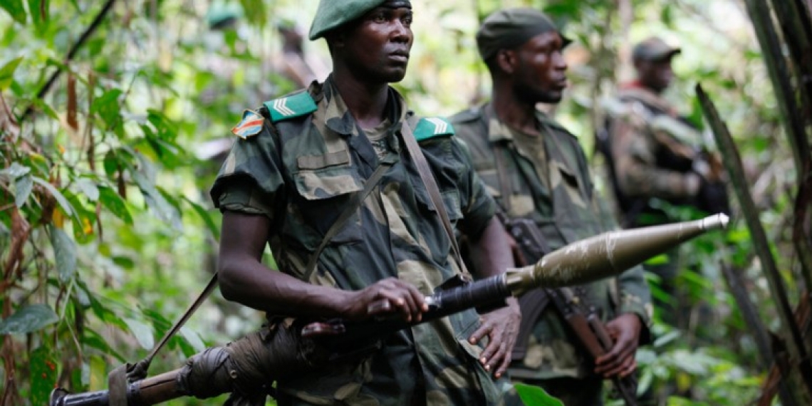 Democratic Republic of Congo military personnel (FARDC) patrol against the Allied Democratic Forces (ADF) and the National Army for the Liberation of Uganda (NALU) rebels near Beni in North-Kivu province, December 31, 2013. The Democratic Republic of Congo is struggling to emerge from decades of violence and instability, particularly in its east, in which millions of people have died, mostly from hunger and disease. A 21,000-strong United Nations peacekeeping mission (MONUSCO) is stationed in the country. REUTERS/Kenny Katombe (DEMOCRATIC REPUBLIC OF CONGO - Tags: POLITICS CIVIL UNREST CONFLICT MILITARY) - GM1EA110J1401